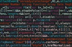 Close-up of colorful coding text on a dark computer screen, representing software development.